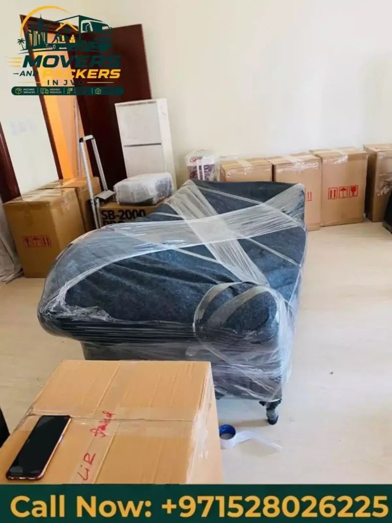Large sofa being moved by experienced movers