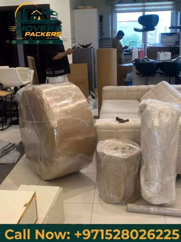 Furniture wrapped with protective moving blankets